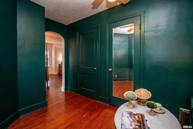 3316 N Biltmore Ave, Peoria, IL 61604 - interior space featuring arched walkways, wood finished floors, and a textured ceiling