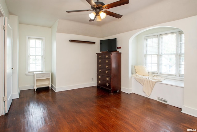 3316 N Biltmore Ave, Peoria, IL 61604 - spare room featuring arched walkways, wood finished floors, and a ceiling fan