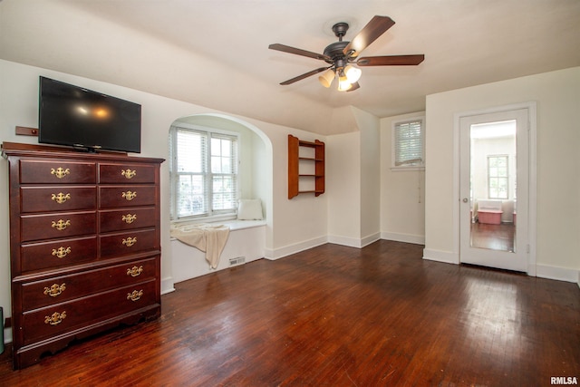 3316 N Biltmore Ave, Peoria, IL 61604 - spare room featuring dark wood-style floors, a ceiling fan, and arched walkways