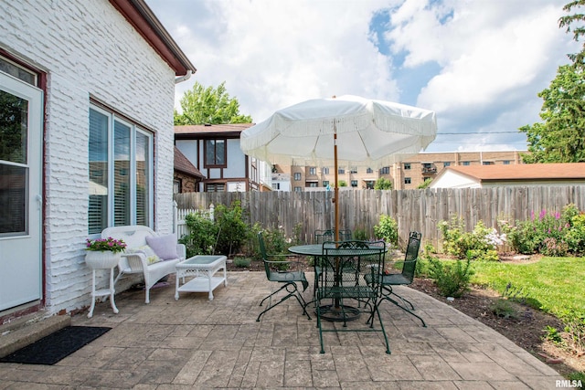 3316 N Biltmore Ave, Peoria, IL 61604 - fenced backyard with a patio and outdoor dining space