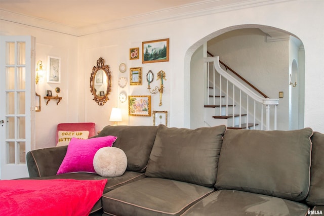 3316 N Biltmore Ave, Peoria, IL 61604 - living room featuring arched walkways, ornamental molding, and stairway