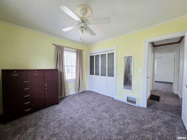 1507 W Circle Rd, Peoria, IL 61604 - unfurnished bedroom featuring dark colored carpet, ornamental molding, and ceiling fan