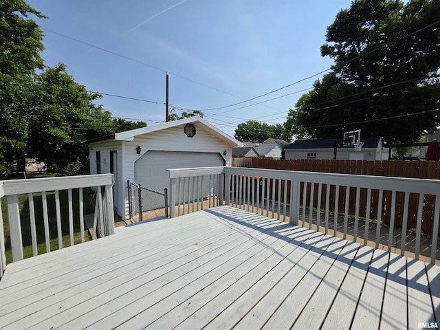1507 W Circle Rd, Peoria, IL 61604 - wooden deck with a detached garage, a fenced backyard, and an outbuilding