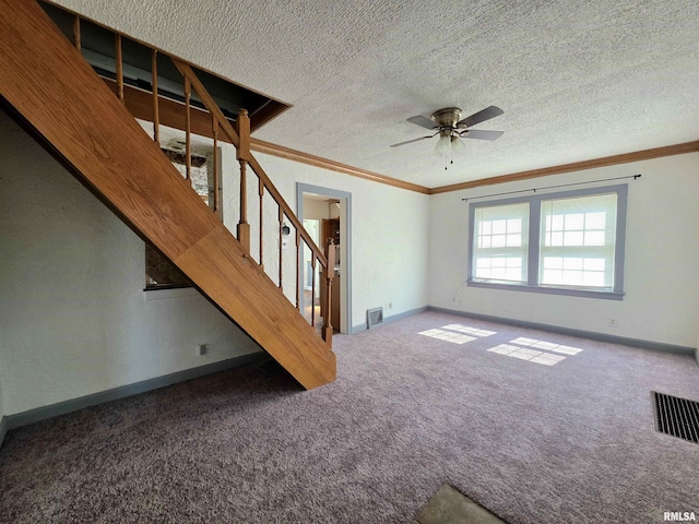 1507 W Circle Rd, Peoria, IL 61604 - unfurnished living room featuring ornamental molding, carpet flooring, stairway, a ceiling fan, and a textured ceiling