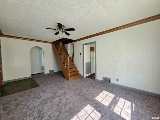 1507 W Circle Rd, Peoria, IL 61604 - unfurnished living room featuring arched walkways, ornamental molding, stairway, carpet flooring, and a textured ceiling