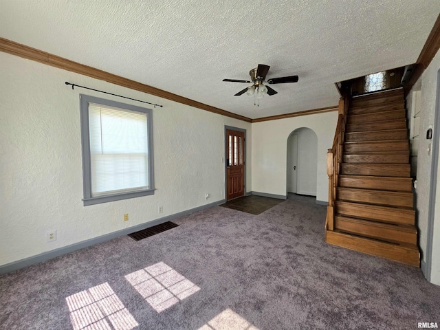 1507 W Circle Rd, Peoria, IL 61604 - unfurnished living room with arched walkways, carpet, stairs, crown molding, and ceiling fan