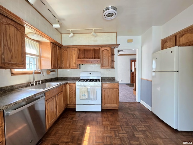 1507 W Circle Rd, Peoria, IL 61604 - kitchen with white appliances, dark countertops, track lighting, and decorative backsplash