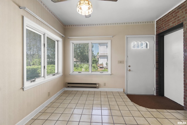 502 W Crestwood Dr, Peoria, IL 61614 - entryway featuring a baseboard radiator, healthy amount of natural light, light tile patterned floors, and ceiling fan