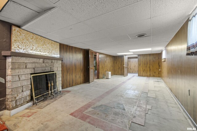 502 W Crestwood Dr, Peoria, IL 61614 - finished below grade area with a fireplace, a paneled ceiling, and wooden walls