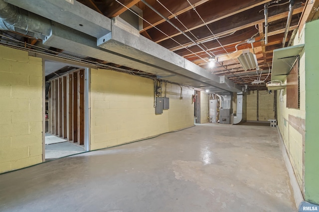 502 W Crestwood Dr, Peoria, IL 61614 - unfinished below grade area featuring water heater, heating unit, concrete block wall, and electric panel
