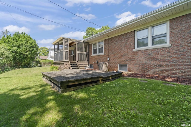 502 W Crestwood Dr, Peoria, IL 61614 - back of property with a sunroom, brick siding, and a deck