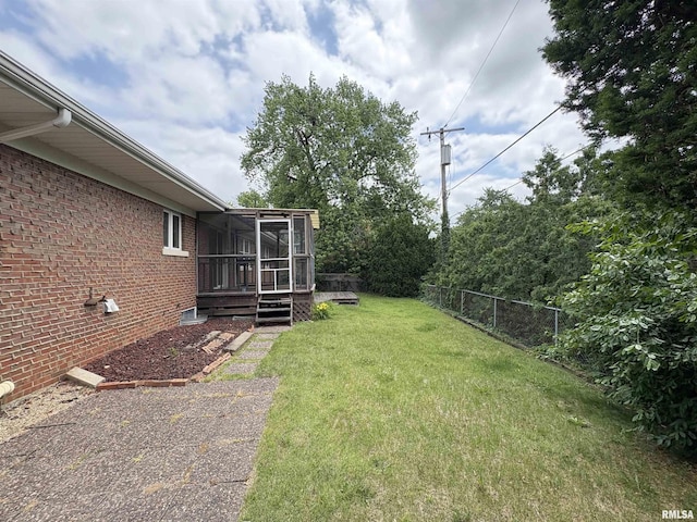 502 W Crestwood Dr, Peoria, IL 61614 - view of yard featuring a sunroom and a deck