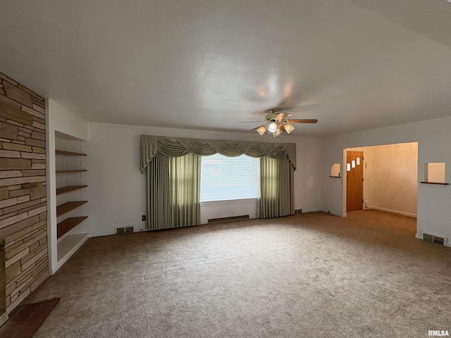 502 W Crestwood Dr, Peoria, IL 61614 - unfurnished living room featuring ceiling fan and carpet floors