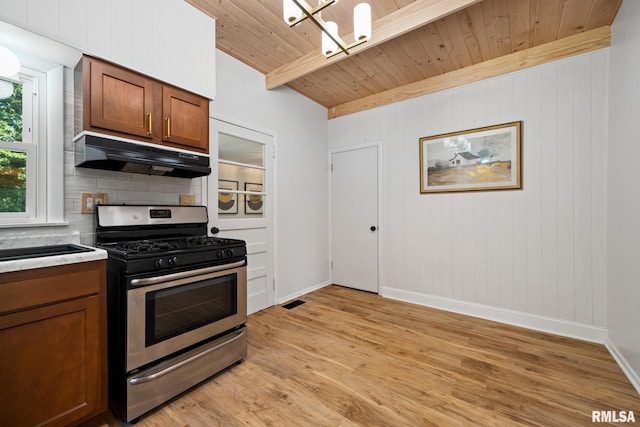 1431 E Rouse Ave, Peoria, IL 61614 - kitchen featuring stainless steel gas range, under cabinet range hood, light wood-type flooring, a wooden ceiling with exposed beams, and decorative backsplash