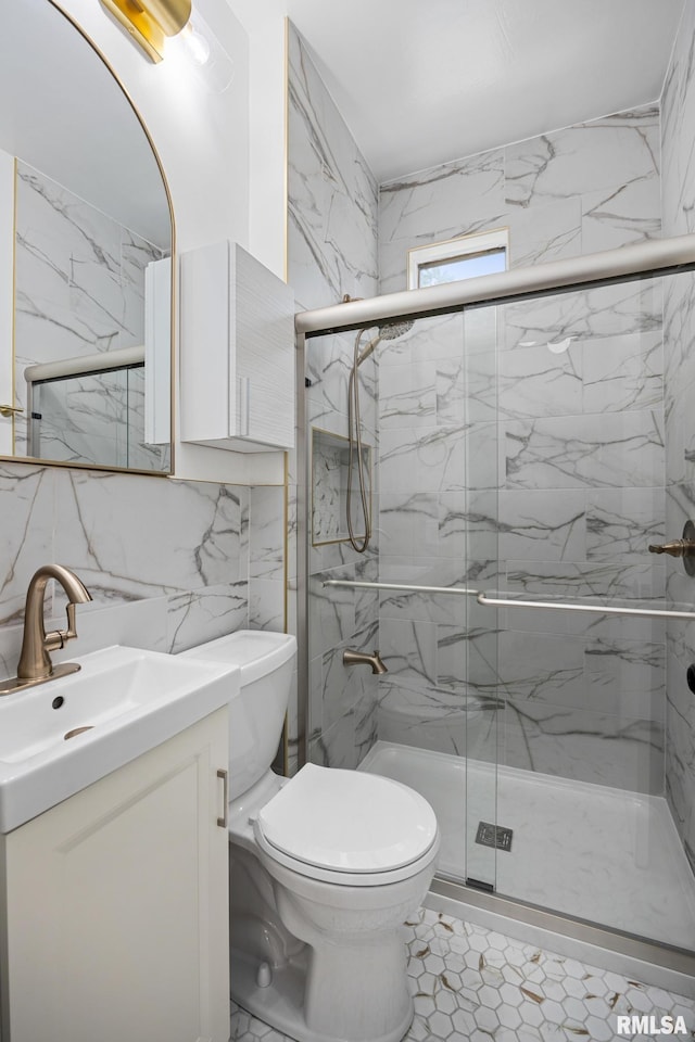 1431 E Rouse Ave, Peoria, IL 61614 - bathroom with vanity, a marble finish shower, tile walls, and backsplash