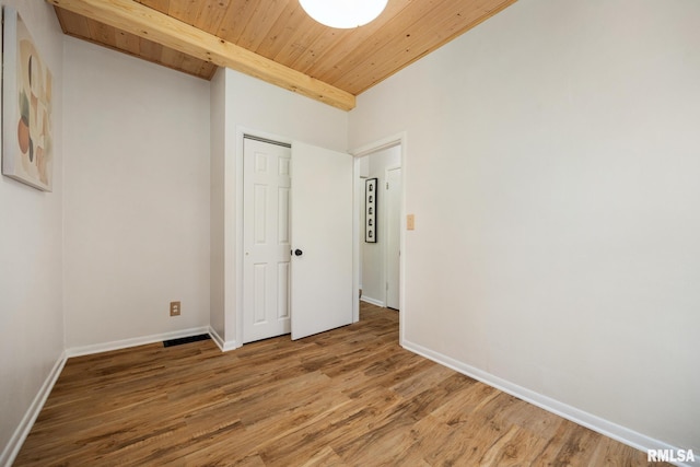 1431 E Rouse Ave, Peoria, IL 61614 - unfurnished bedroom featuring light wood-style flooring, wood ceiling, and a closet
