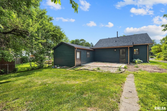 1431 E Rouse Ave, Peoria, IL 61614 - back of property with a patio and a shingled roof