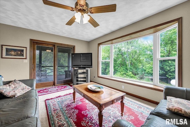 1522 N Stone School Rd, Elmwood, IL 61529 - living area with ceiling fan and baseboards