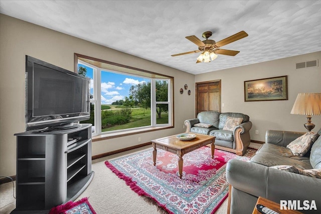 1522 N Stone School Rd, Elmwood, IL 61529 - carpeted living area featuring baseboards and a ceiling fan
