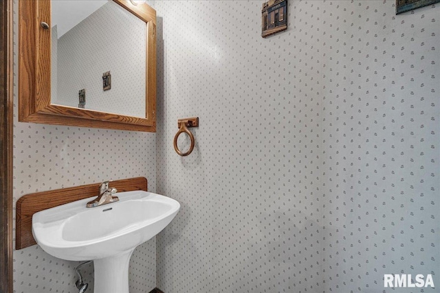 1522 N Stone School Rd, Elmwood, IL 61529 - bathroom with wallpapered walls and a sink