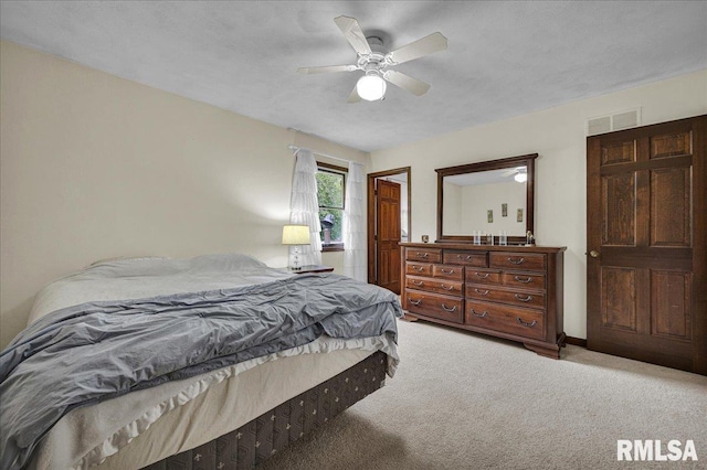 1522 N Stone School Rd, Elmwood, IL 61529 - bedroom with light carpet and ceiling fan