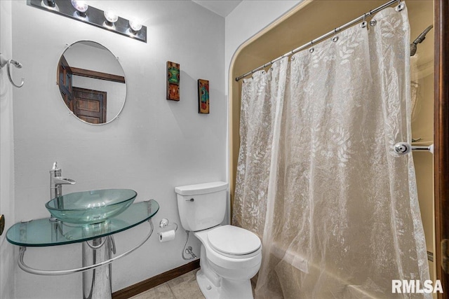 1522 N Stone School Rd, Elmwood, IL 61529 - bathroom featuring a shower with shower curtain and tile patterned floors