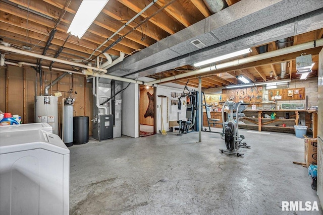 1522 N Stone School Rd, Elmwood, IL 61529 - unfinished basement featuring heating unit, a water softener, water heater, washer and clothes dryer, and a workshop area