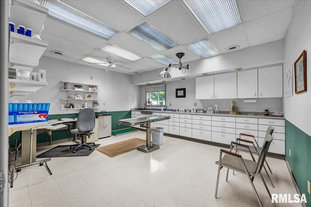 1522 N Stone School Rd, Elmwood, IL 61529 - office with a drop ceiling, ceiling fan, light floors, and built in study area