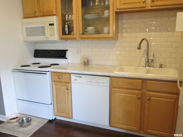 2010 W Westbrook Dr, Peoria, IL 61614 - kitchen with white appliances, tasteful backsplash, glass insert cabinets, and dark wood-style floors