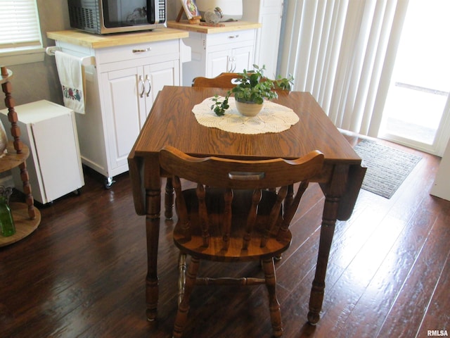 2010 W Westbrook Dr, Peoria, IL 61614 - dining space featuring dark wood-style floors and healthy amount of natural light