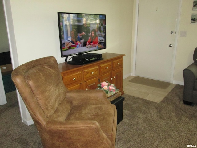 2010 W Westbrook Dr, Peoria, IL 61614 - carpeted living room with baseboards and tile patterned flooring
