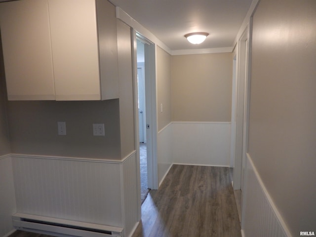 300 E Summer St, Plymouth, IL 62367 - hall featuring a baseboard heating unit, wood finished floors, and wainscoting