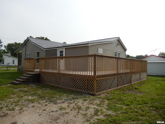 300 E Summer St, Plymouth, IL 62367 - back of property featuring a wooden deck and a metal roof