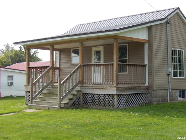 300 E Summer St, Plymouth, IL 62367 - back of house with a yard, a metal roof, and cooling unit