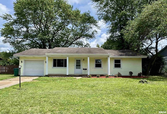 133 Holden Dr, Macomb, IL 61455 - ranch-style home featuring an attached garage, concrete driveway, and a porch