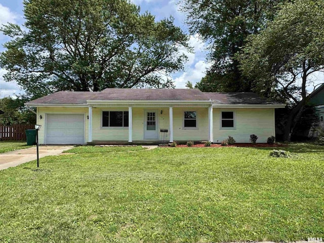 133 Holden Dr, Macomb, IL 61455 - ranch-style home with an attached garage, driveway, and a porch