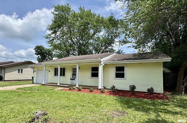 133 Holden Dr, Macomb, IL 61455 - ranch-style house with a porch, an attached garage, a front yard, and concrete driveway