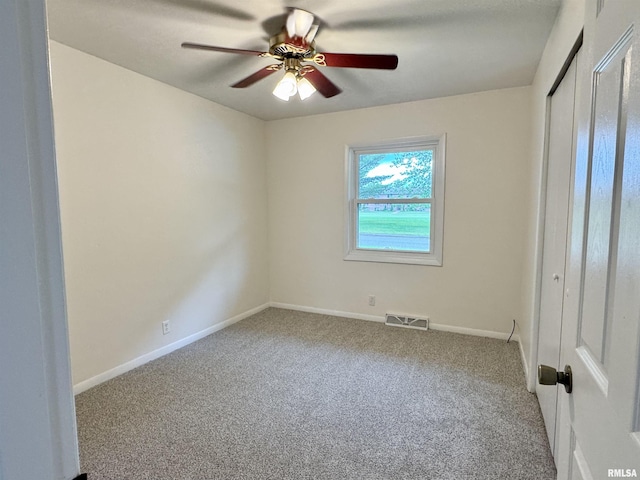 133 Holden Dr, Macomb, IL 61455 - unfurnished bedroom with carpet floors, a closet, and ceiling fan