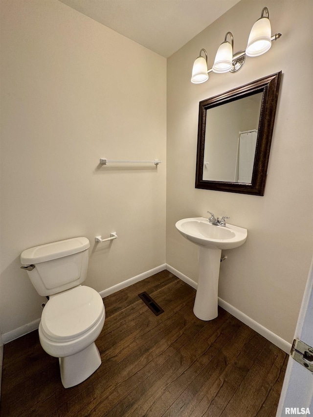 133 Holden Dr, Macomb, IL 61455 - bathroom featuring toilet and wood finished floors