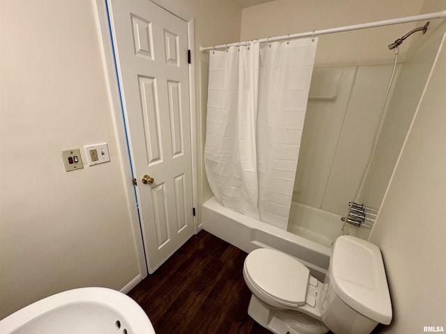 133 Holden Dr, Macomb, IL 61455 - bathroom featuring wood finished floors and shower / tub combo