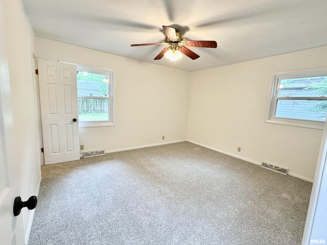133 Holden Dr, Macomb, IL 61455 - spare room with carpet floors and ceiling fan