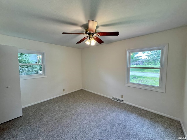 133 Holden Dr, Macomb, IL 61455 - unfurnished room featuring carpet flooring and a ceiling fan