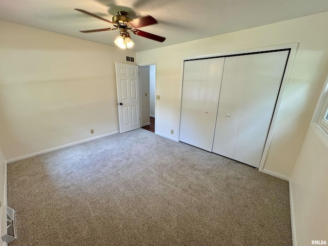 133 Holden Dr, Macomb, IL 61455 - unfurnished bedroom with carpet flooring, a closet, and ceiling fan