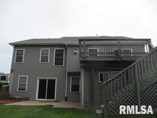 3708 Bloomington Rd, East Peoria, IL 61611 - back of house featuring a lawn and a deck