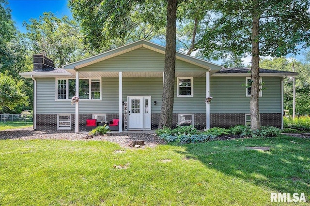 1536 Hickory Point Rd, Metamora, IL 61548 - split foyer home with a front lawn and a chimney