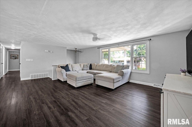 1536 Hickory Point Rd, Metamora, IL 61548 - living room featuring a textured ceiling and dark wood finished floors