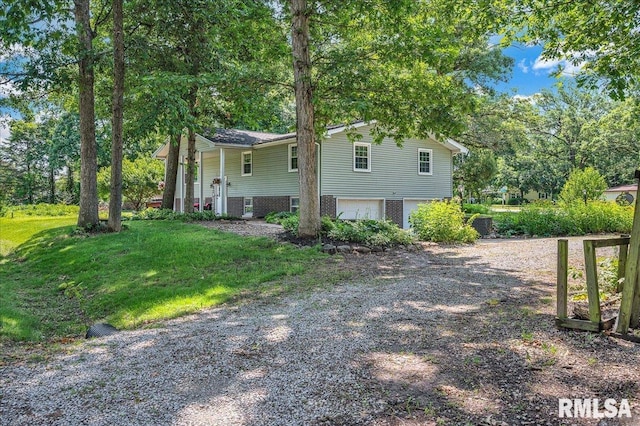 1536 Hickory Point Rd, Metamora, IL 61548 - view of side of property featuring driveway and a garage