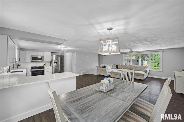 1536 Hickory Point Rd, Metamora, IL 61548 - dining area featuring dark wood-style floors and baseboards