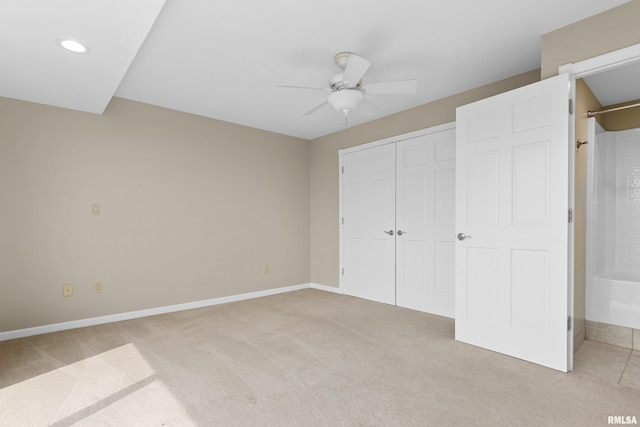 123 SW Jefferson St Unit E10C, Peoria, IL 61602 - unfurnished bedroom featuring light colored carpet, a closet, a ceiling fan, and recessed lighting
