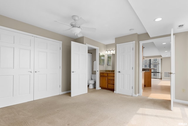 123 SW Jefferson St Unit E10C, Peoria, IL 61602 - unfurnished bedroom featuring light colored carpet, a closet, recessed lighting, ensuite bath, and a ceiling fan